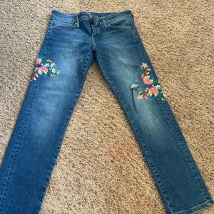 Dark Wash Jeans with Embroidered Flowers on them